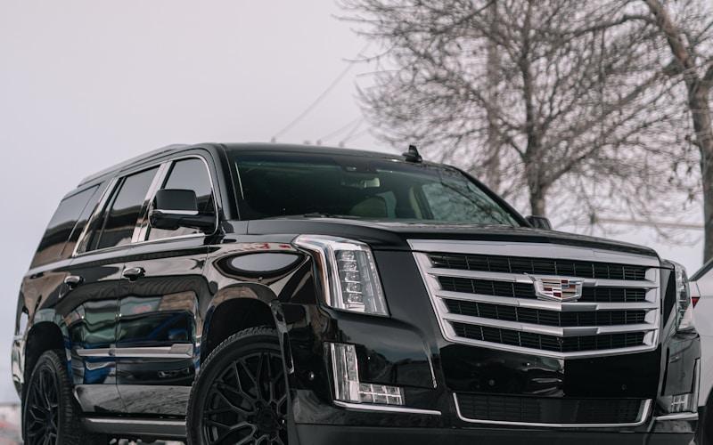 Black Cadillac Escalade executive vehicle